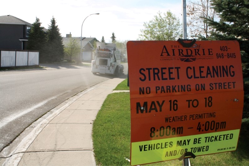 A street sweeper enters the Waterstone area on May 16. The city said aggressive ticketing and towing as well as an awareness campaign has lead to far less vehicles being