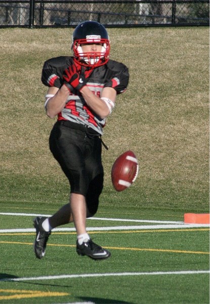 Northern Raiders&#8217; Josh Duazo drops a pass from quarterback Duncan Little in a 63-14 loss to the Calgary Prairie Fire, May 10 at Shouldice Park in Calgary.