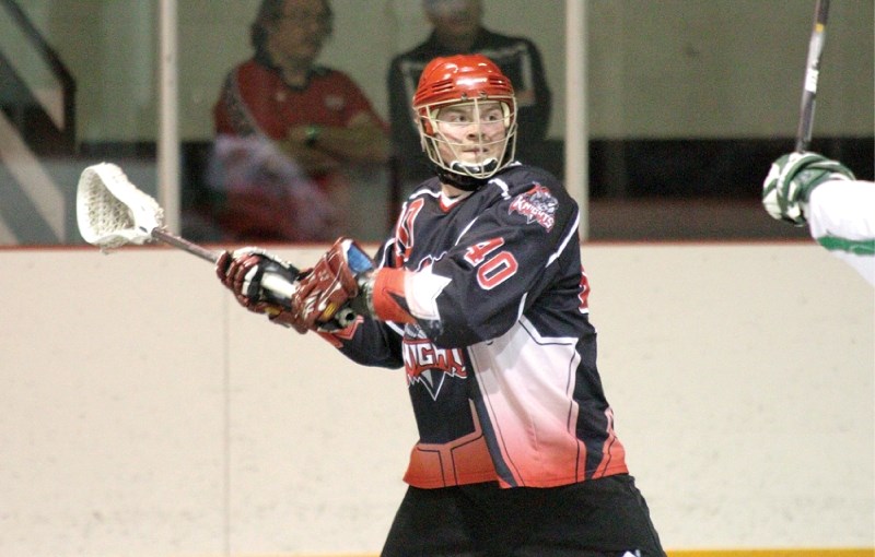 Travis Longacre looks for a teammate to pass to during the lacrosse team&#8217;s home opener in Crossfield May 11.
