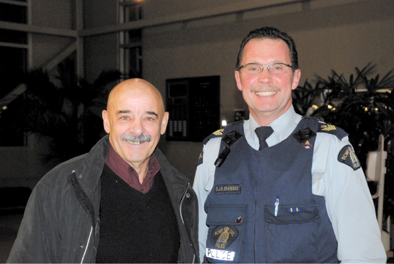 Ennio Ricci, president of Airdrie COP, and Airdrie RCMP Sergeant Dennis Esayanko are all smiles after Airdrie City council it will provide $4,000 in funding for the