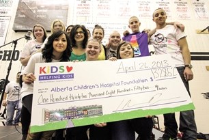 Organizers of the Ride of the Mustangs Alberta Children&#8217;s Hospital fundraiser pose with the cheque for $132,852 raised over the two-day event at George McDougall High