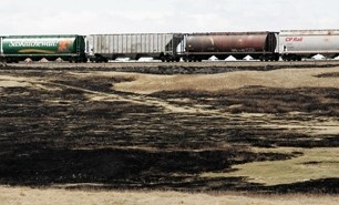 The aftermath of a large grass fire was started by a train across the highway from CrossIron Mills mall, April 24.