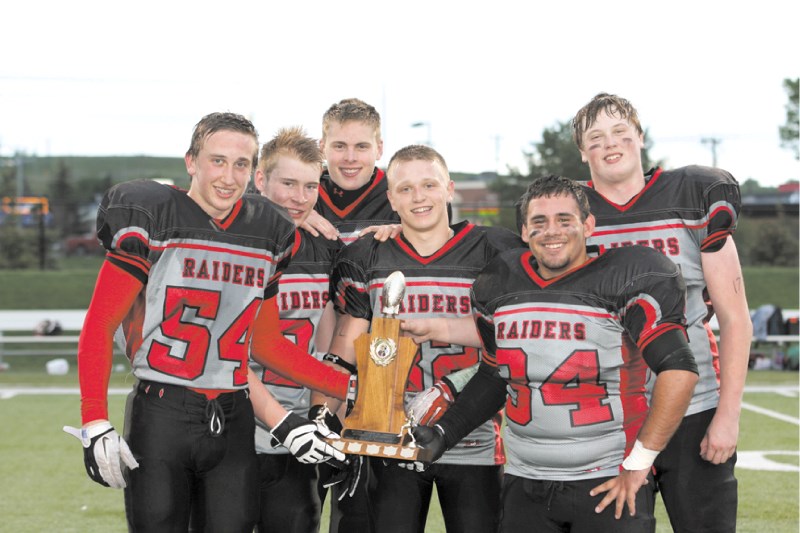 The Airdrie Northern Raiders captains pose with the Calgary Midget Football Association Division II trophy May 30. The Raiders defeated the Calgary Falcons 41-12 in the final.