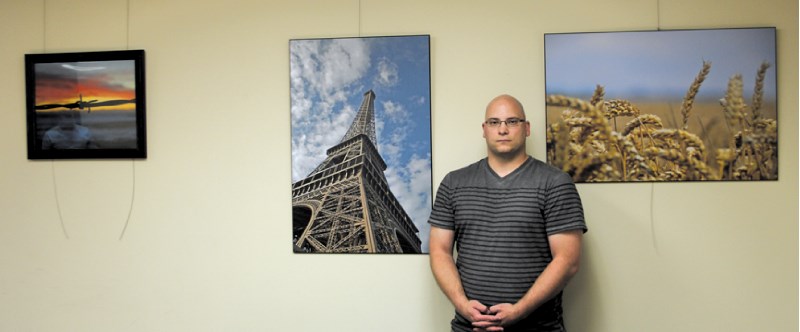 Darryl Berntsen with three of his photographs that will be on display at Airdrie City Hall for the next two months as part of the City&#8217;s Art in City Hall program.
