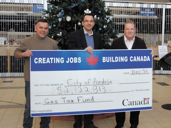 Wildrose MP Blake Richards stands with Alderman Fred Burley and Mayor Peter Brown at City Hall on Dec. 7. Richards announced that Airdrie will receive $2.12 million in