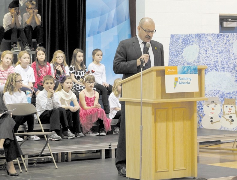 Alberta Minister of Infrastructure Ric McIver announces a news K-5 school for Kings Heights at R.J Hawkey School on Feb. 13.