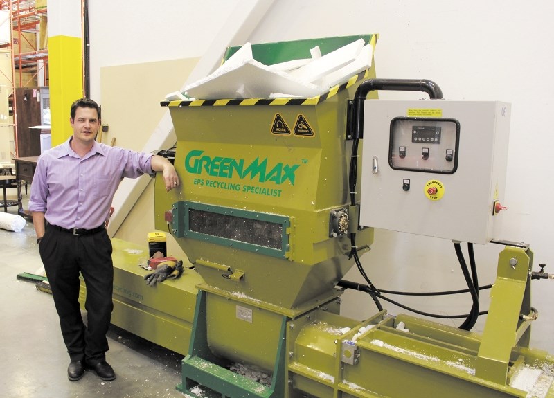 McArthur Furniture Airdrie store manager Darin Pound with the store&#8217;s recently acquire polystyrene densifier. The machine has helped Pound reduce his company&#8217;s