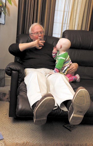 Tony Hirons with his granddaughter, Phoenix, before the strokes that took away his ability to care for himself.