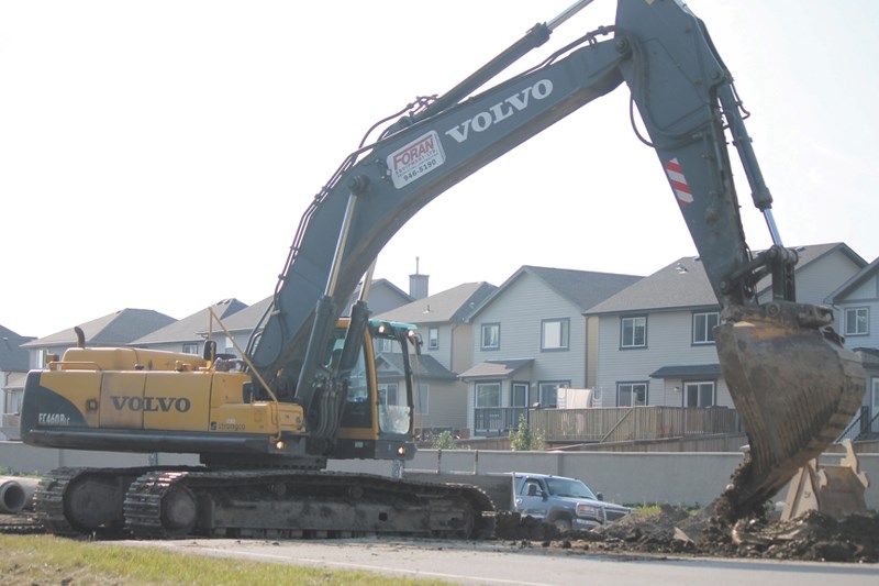 A bulldozer began digging up Yankee Valley Blvd. on Aug. 6 between East Lake Blvd. and Kings Heights Gate as part of a road widening project. Temporary road closures will