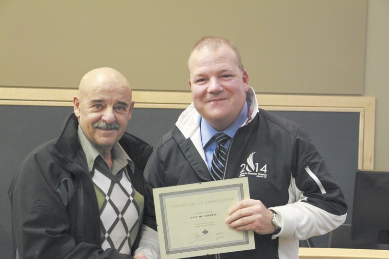 President of the Airdrie Citizens on Patrol Association, Ennio Ricci, presented a certificate of appreciation to Airdrie City council on Dec. 15, in recognition of the