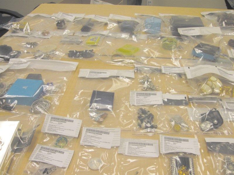 Some of the 600-plus pieces of stolen property recovered from a vehicle involved in a collision on Range Road 13 in Airdrie on May 29 are displayed at the Airdrie RCMP