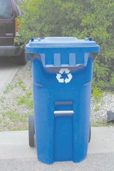 Blue carts will eventually be a fixture in front of every residence in Airdrie after council approved moving forward with curbside recycling Sept. 21.