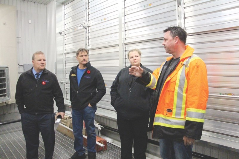 Mayor Peter Brown (left), Deputy Mayor Darrell Belyk and Alderman Candice Kolson listened to Kelly McKague, facilities co-ordinator with Public Works, as he explained the