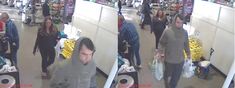 Surveillance footage shows two people walking out of the Airdrie Sobey&#8217;s without paying for their purchases, Oct. 5.