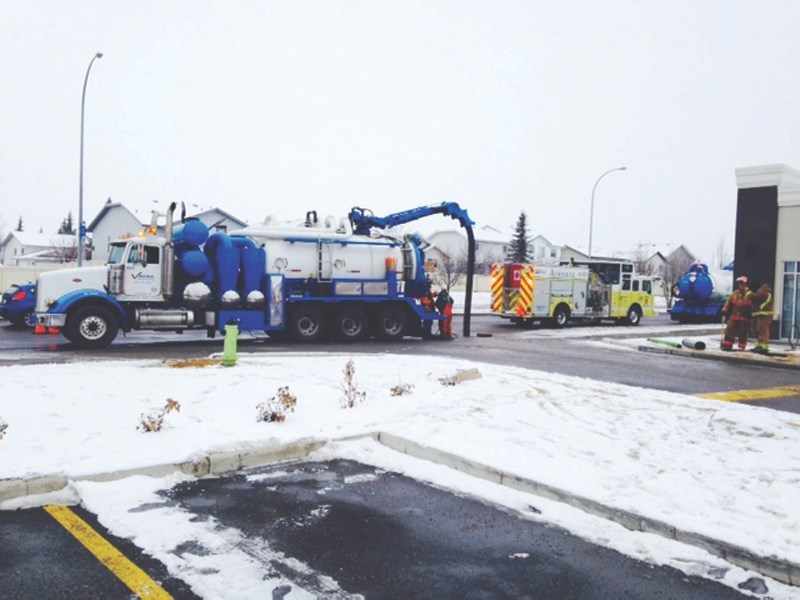 The Airdrie Fire Department and Airdrie Public Works department cleaned up a gasoline spill on Dec. 10 with the help of a specialized truck contracted to do the work.
