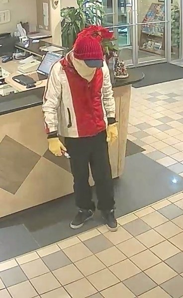 A suspect allged to be responsible for an armed robbery at the Super 8 Motel in Airdrie on Jan. 1 is pictured in photos obtained by RCMP.