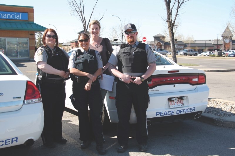 Airdrie&#8217;s Municipal Enforcement department deals with more than just barking dogs and unshoveled sidewalks. (Left to right): Peace Officer Christine Giffin, Peace