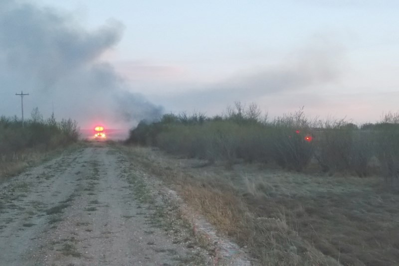 The Airdrie Fire Department faced some challenges fighting a grassfire in a wooded area west of Chinook Winds Drive April 19.
