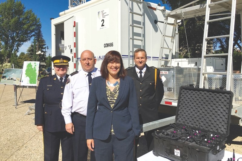 (From left) RCMP Deputy Commissioner Marianne Ryan, Fort McMurray Deputy Fire Chief Brad Grainger, Minister of Justice and Solicitor General Kathleen Ganley and Executive