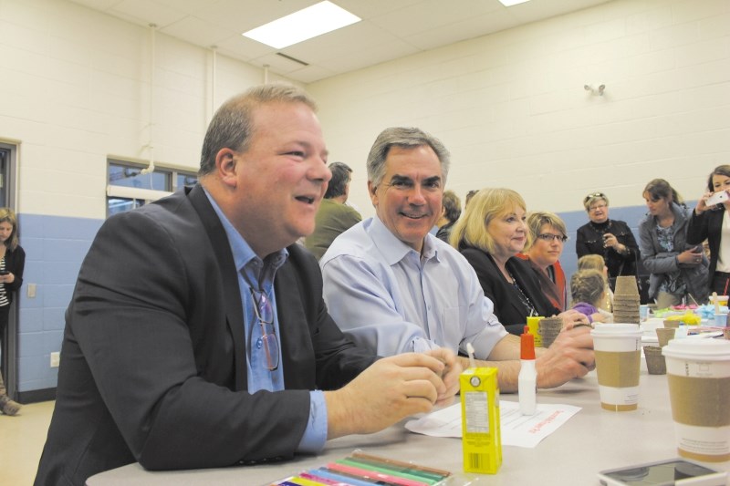 Mayor Peter Brown and former Alberta Premier Jim Prentice met with potential voters during the 2015 election campaign.