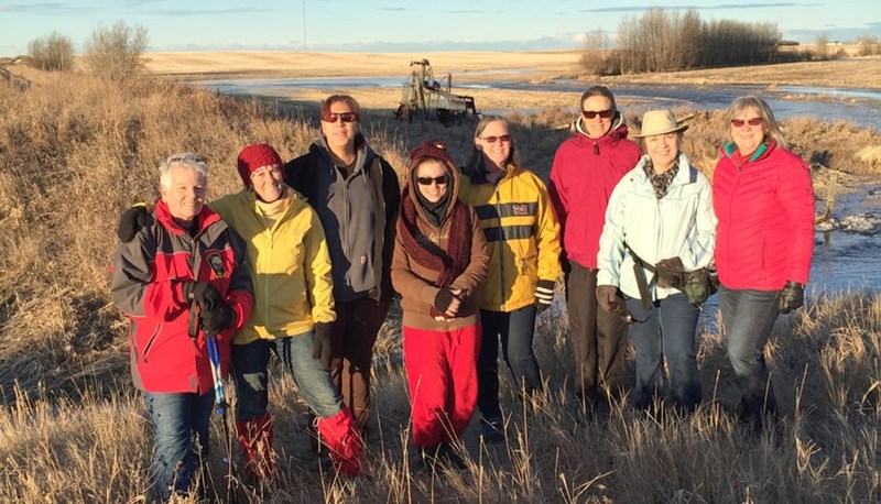 Members of the Meadowlark Society stand along a portion of the future trail connecting Irricana and Beiseker.