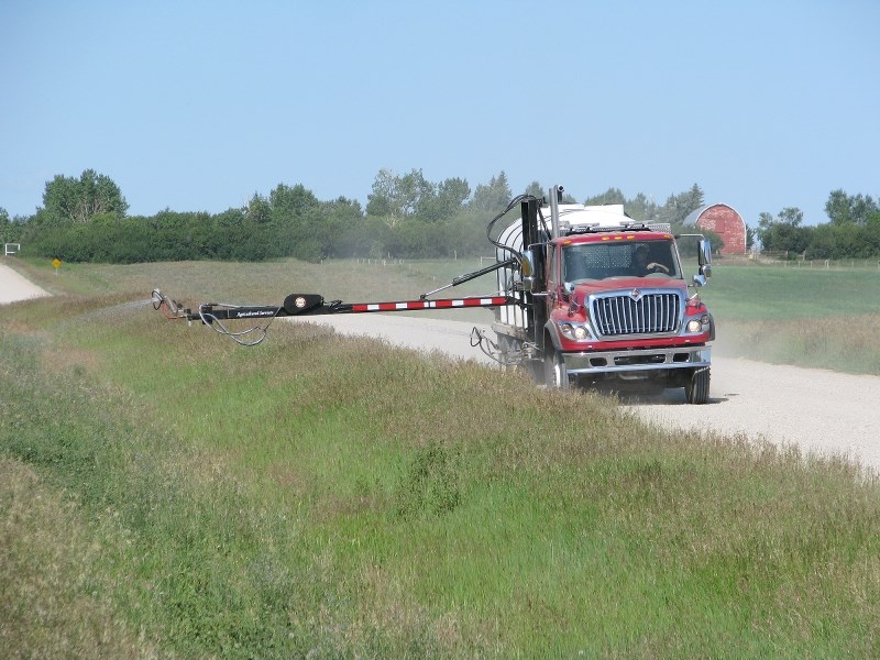 A spray truck attends to a Rocky View County road. Council heard a report from the Agricultural Service Board at its April 10 meeting that included information on weed and