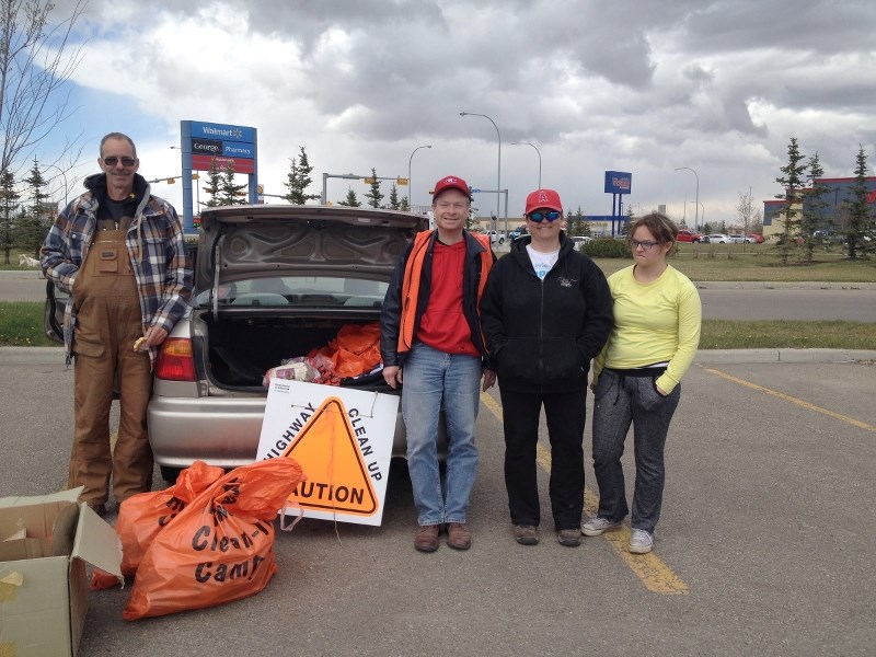 Dave Maffitt (centre), along with his family and a volunteer, after picking up litter along the highway in 2015. Maffitt said the annual highway cleanup is a great volunteer