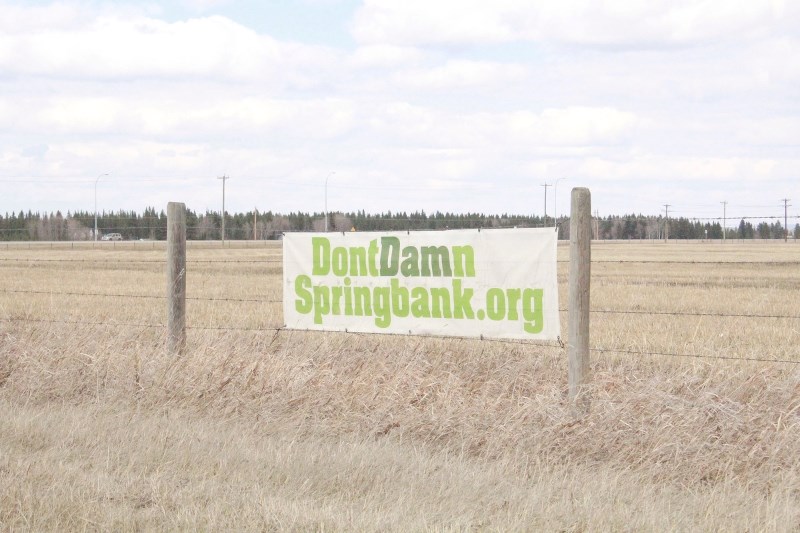 A Don&#8217;t Damn Springbank sign promotes the group&#8217;s website along Highway 22. The group came before Rocky View County&#8217;s Policy and Priorities Committee to