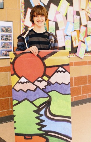 Grade 8 Banded Peak student Nathan Stelfox won a contest to design a new banner for Bragg Creek.