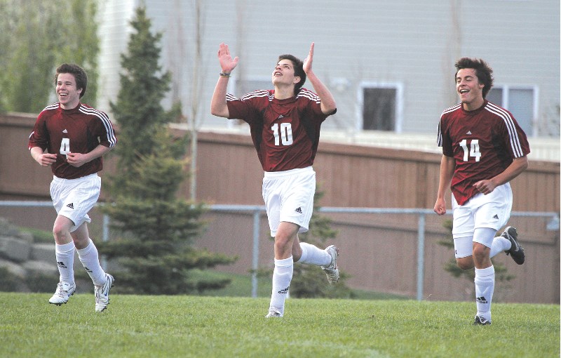 Cochrane Cobras Tomas Assel-Moore, Vini Rescend, and Zach Kerr celebrate a goal late during the Rocky View Sports Association bronze medal match, June 1.