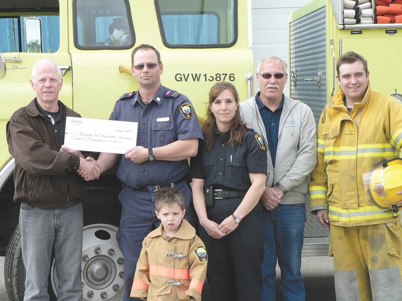 The Beiseker Fire Department received $20,000 from Encana for a new rescue fire unit, May 31. On hand for the presentation (left to right) were Craig Stone, Jim Fox, Roxanne