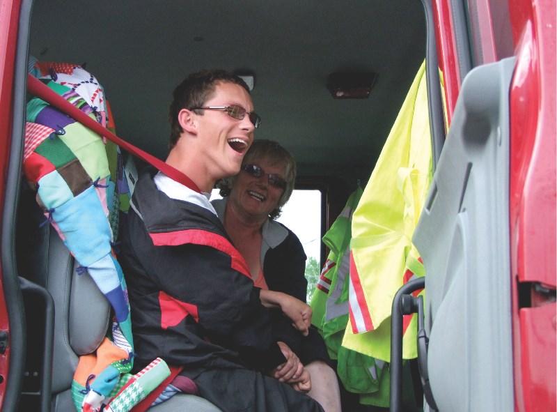 Jordan Dobko fulfilled a lifelong desire when he was given a ride in a fire truck, June 22. Dobko was treated as a special guest after he made a donation of stuffed animals
