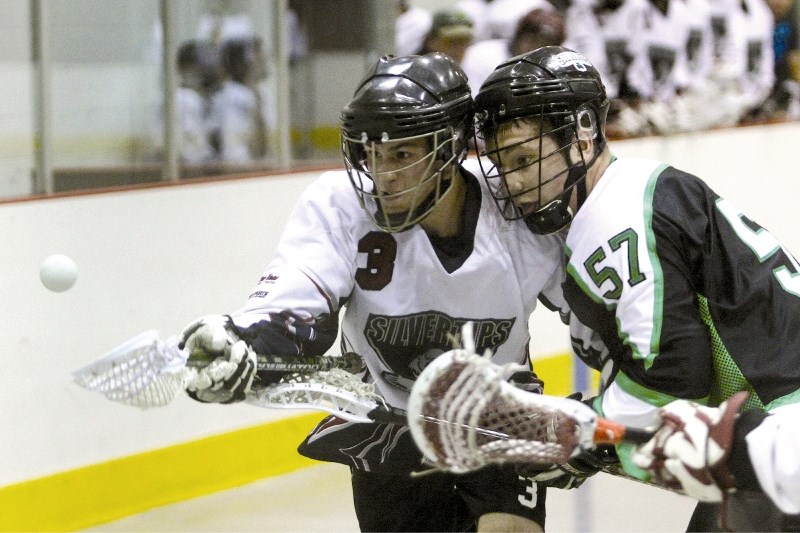 Rocky View Silvertips&#8217; Brandon Spina battles for the free ball with his Calgary Shamrock opponent Colton Barby during the first game of the Rocky Mountain Lacrosse