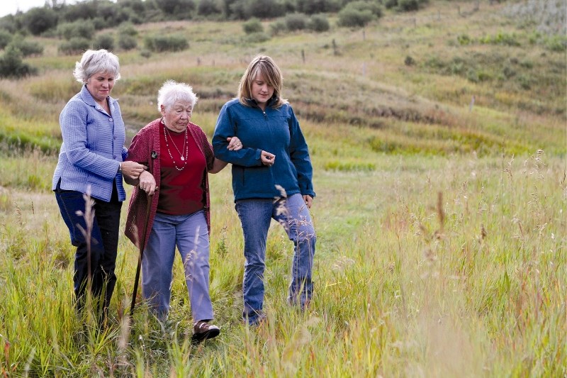 Edith Wearmouth, Vernice Wearmouth and Lori-Anne Eklund take a walk through their land in preparation for the 125th anniversary celebration of WineGlass Ranch, slated for