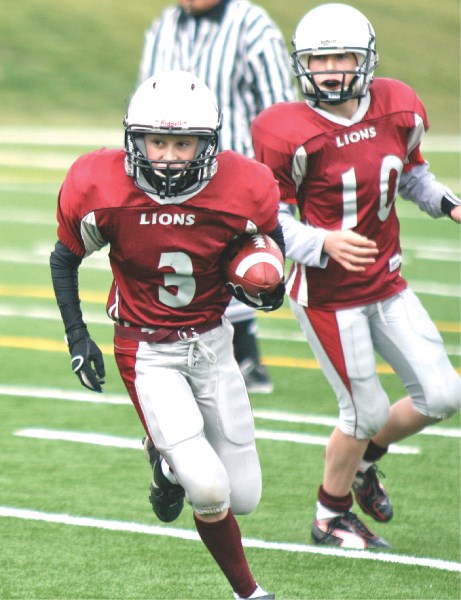 Peewee Lions running back Erik Nusl hustles down field, in game action against the AIrdrie Storm, Sept. 18.