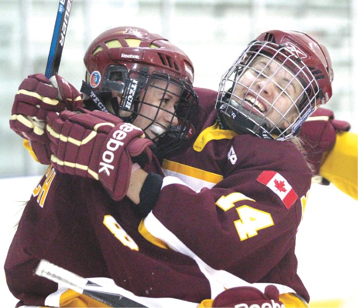 Amy Helfrich and Morgan Sakundiak celebrate Helfrich&#8217;s goal during the Edge Mountaineers&#8217; 2-2 tie with the Balmoral Hall Blazers on Oct. 30 at the Edge