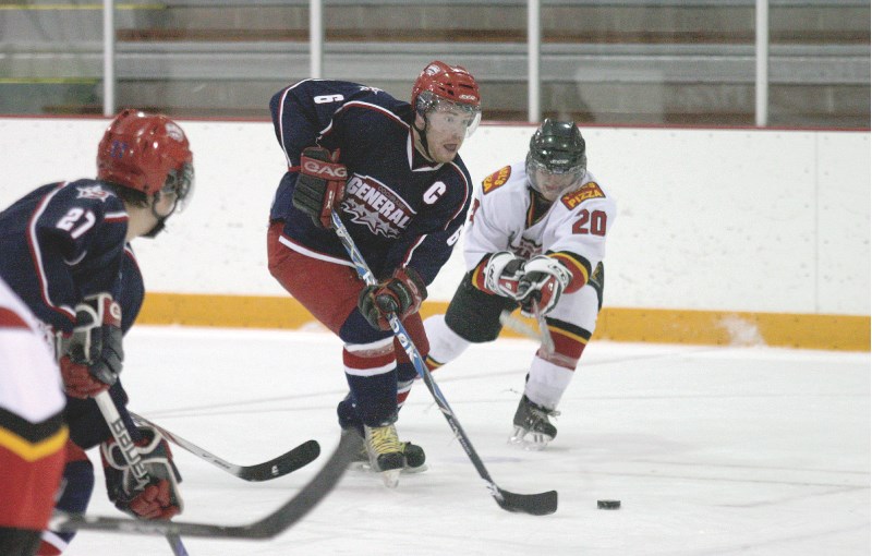 Cochrane Generals captain Danny McSween drives past the Airdrie Thunder&#8217;s Mark Rollo, on home ice, Nov. 21. The Generals came from behind to beat Airdrie 7-6, improving 