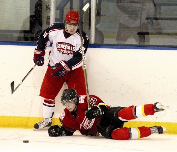Cochrane&#8217;s Wes Kashuba knocked Airdrie&#8217;s Kelly Duke off the puck &#8211; with authority &#8211; in his team&#8217;s 9-2 road win, Jan. 7.