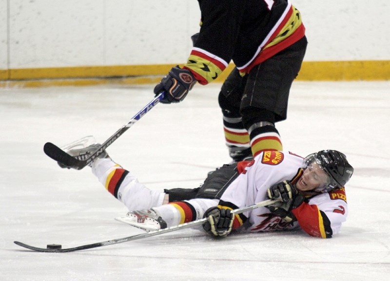 Airdrie defenceman Ryan Russell gets knocked down during second period action of the Thunder&#8217;s 5-4 loss to the Thrashers in Three Hills, Feb. 28.