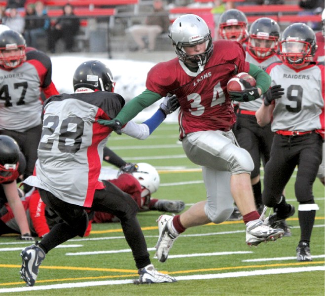 Lions&#8217; running back Ryder Stone scampers in for his second of three touchdowns during Cochrane&#8217;s 22-0 season-opening victory over the Northern Raiders at