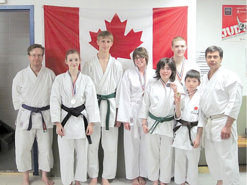 Members of the Airdrie JKA karate dojo pose for a photo following the team&#8217;s medal haul at the Canadian Shotokan Karate Association International tournament in Calgary