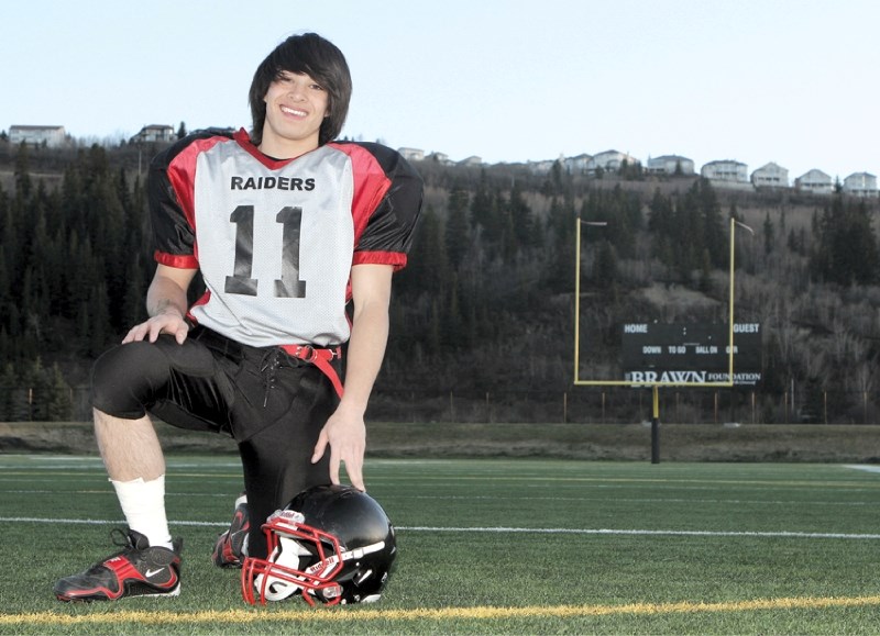 Northern Raiders&#8217; running back Josh Duazo poses for a photo at Shouldice Park&#8217;s 50-yard line, after his team&#8217;s May 11 loss to the Calgary Cowboys.