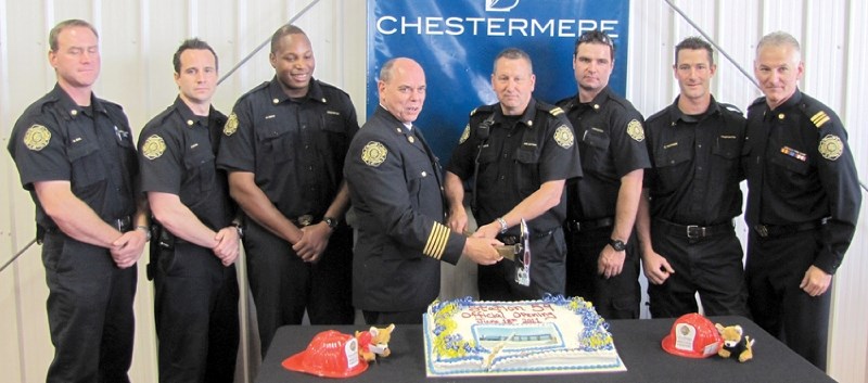 (Top) Local firefighters (from left to right) Bill Whol, Chad Moore, Girvan Smith, Chief Ken McMullen, Captain Brian Pomrenke, Oskar Sabramowicz, David Insinger and District