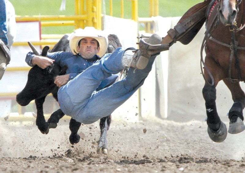 Airdrie&#8217;s Duane Gervais finds himself in a tough position during his steer wrestling run July 1 at the Airdrie Pro Rodeo.