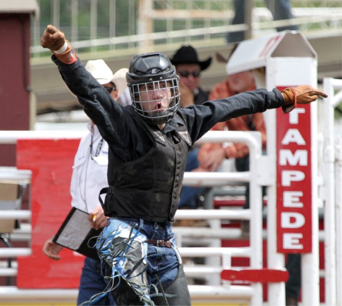 Kyler Hooper, of Airdrie, celebrates his 73 point ride on July 12 at the Calgary Stampede.