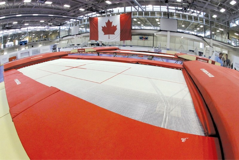 New trampolines, shipped in from Quebec, wait to be used, after being set up at Genesis Place, July 26. More than 200 of the top trampoline and tumbling athletes from across