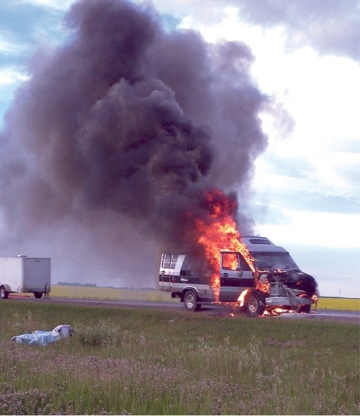 Police were forced to close Highway 2 for 15 minutes to give emergency crew access to this van fire, July 28. Painters working out of the van were able to remove paint