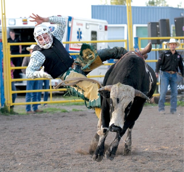 Darren Smith is dismissed during the Fantasy Adventure Bull Riding Get Bucked event at the Airdrie rodeo grounds, Aug. 19.