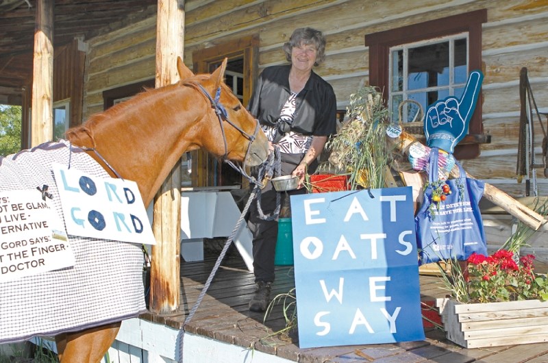Sarah Leete is working to raise awareness about breast and prostate cancers. She is pictured here, along with her borrowed gelding Lord Gord, at her historical house near