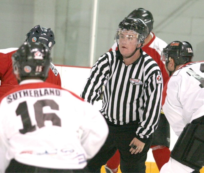 City View photographer Covy Moore served as celebrity linesman at the Crossfield Raise The Rinks Flames Alumni Charity Game, Oct. 15 at the Pete Knight Arena..
